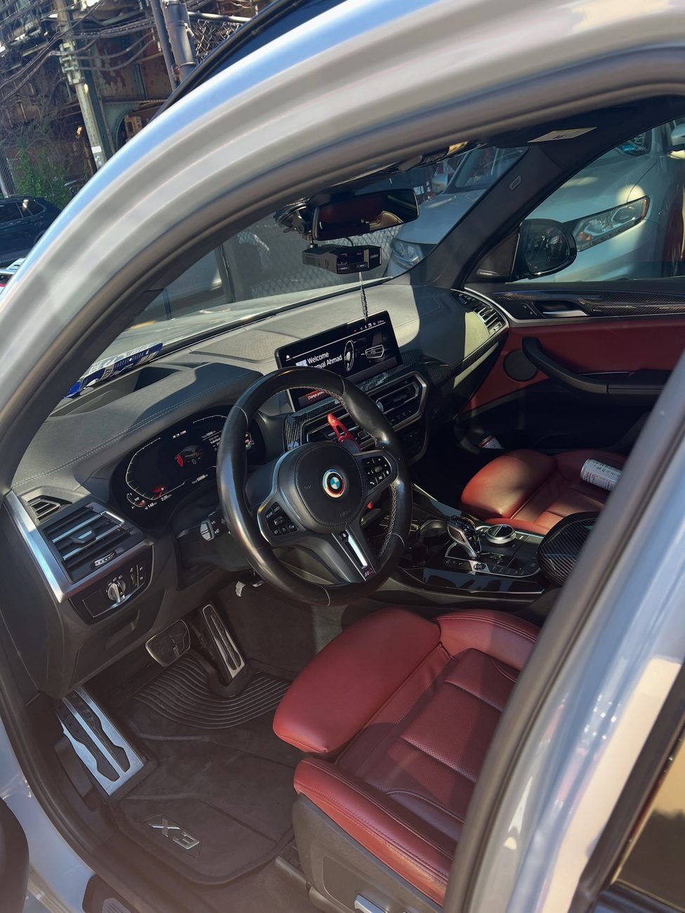 Red-leather interior of a 2023 BMW X3 M40i detailed at W12 Car Spa